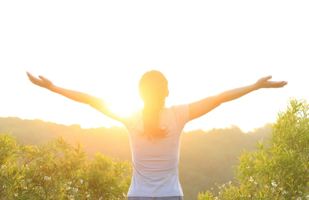 woman excited with sunrise
